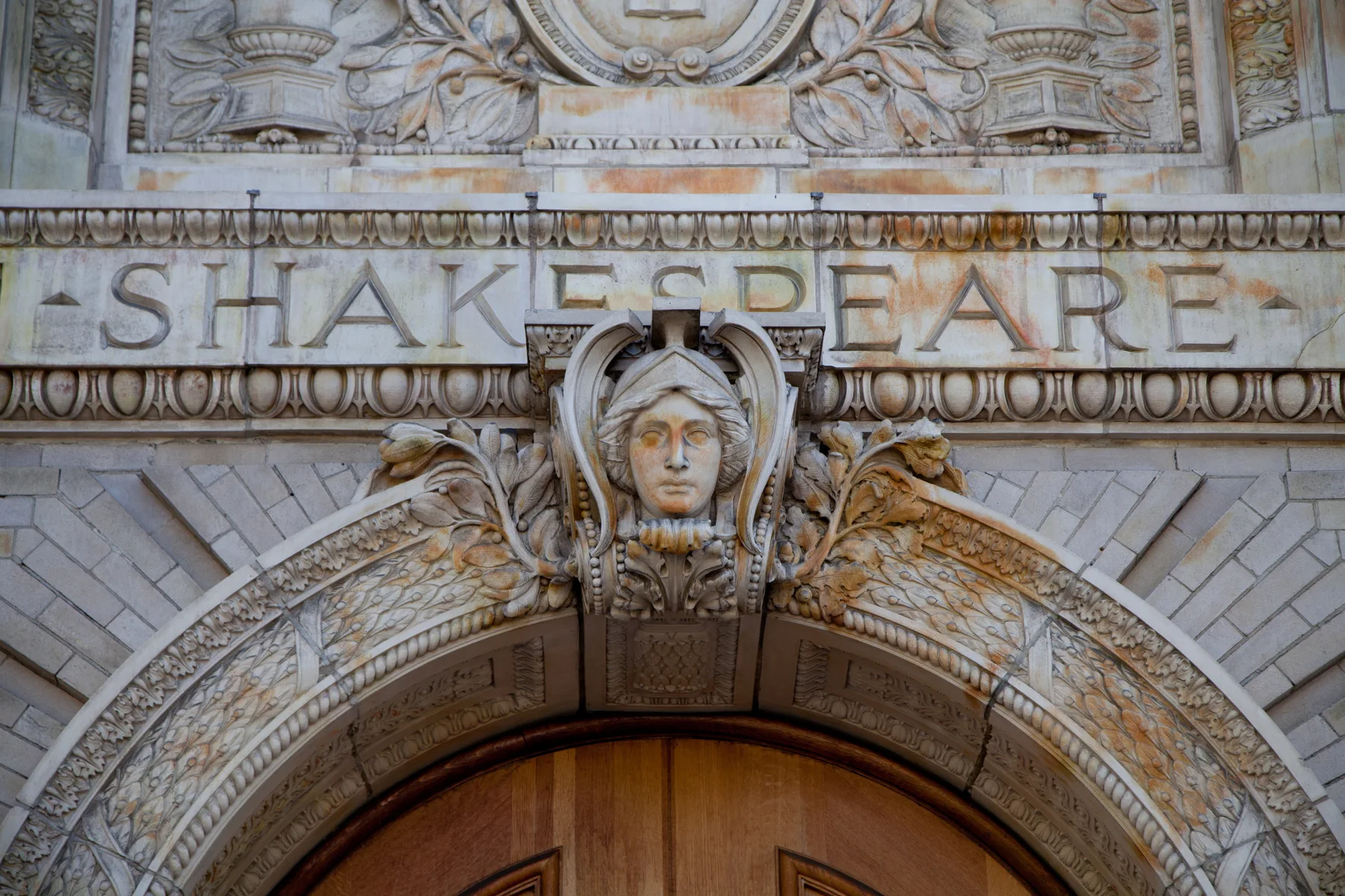 Ornamental stone arch above the entrance of the African American Museum and Library at Oakland
