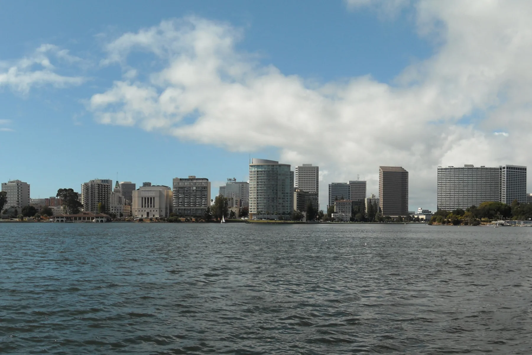 Oakland skyline viewed across the broad water of Lake Merritt